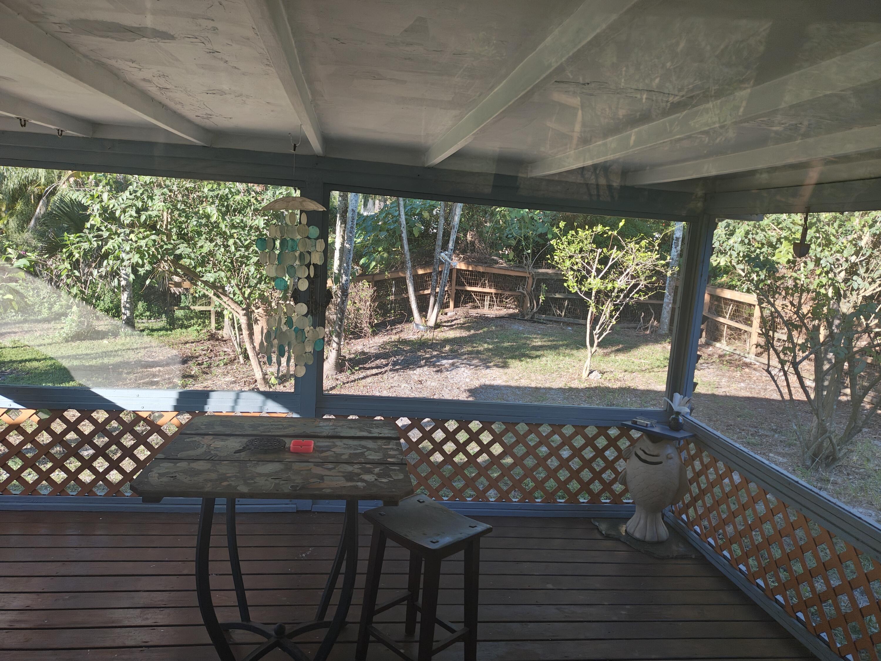 13747 42nd Road North Royal Palm Beach, FL 33411 - Photo 12 of 31 a view of a patio with wooden floor