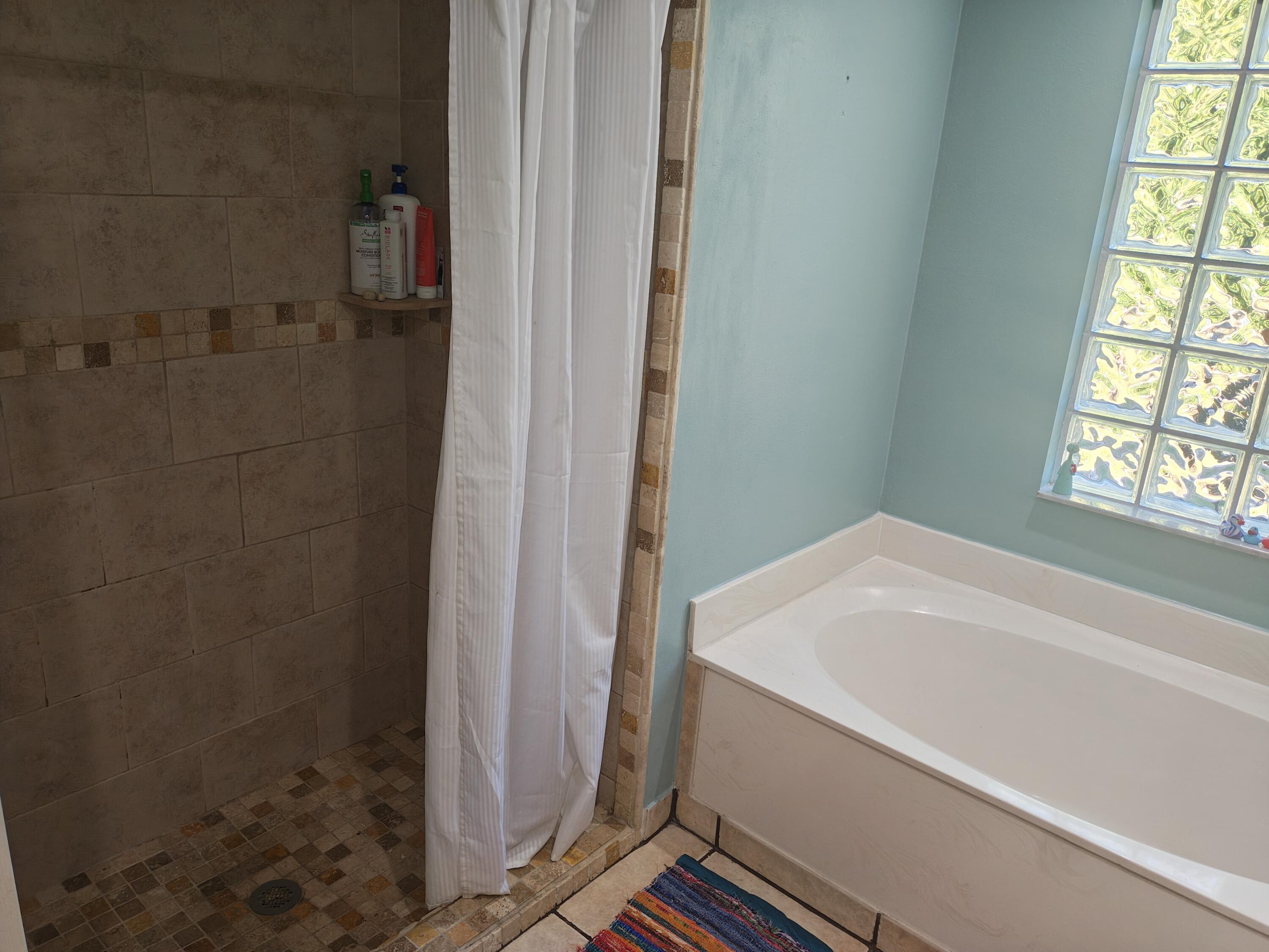 13747 42nd Road North Royal Palm Beach, FL 33411 - Photo 25 of 31 a bathroom with a bathtub and window