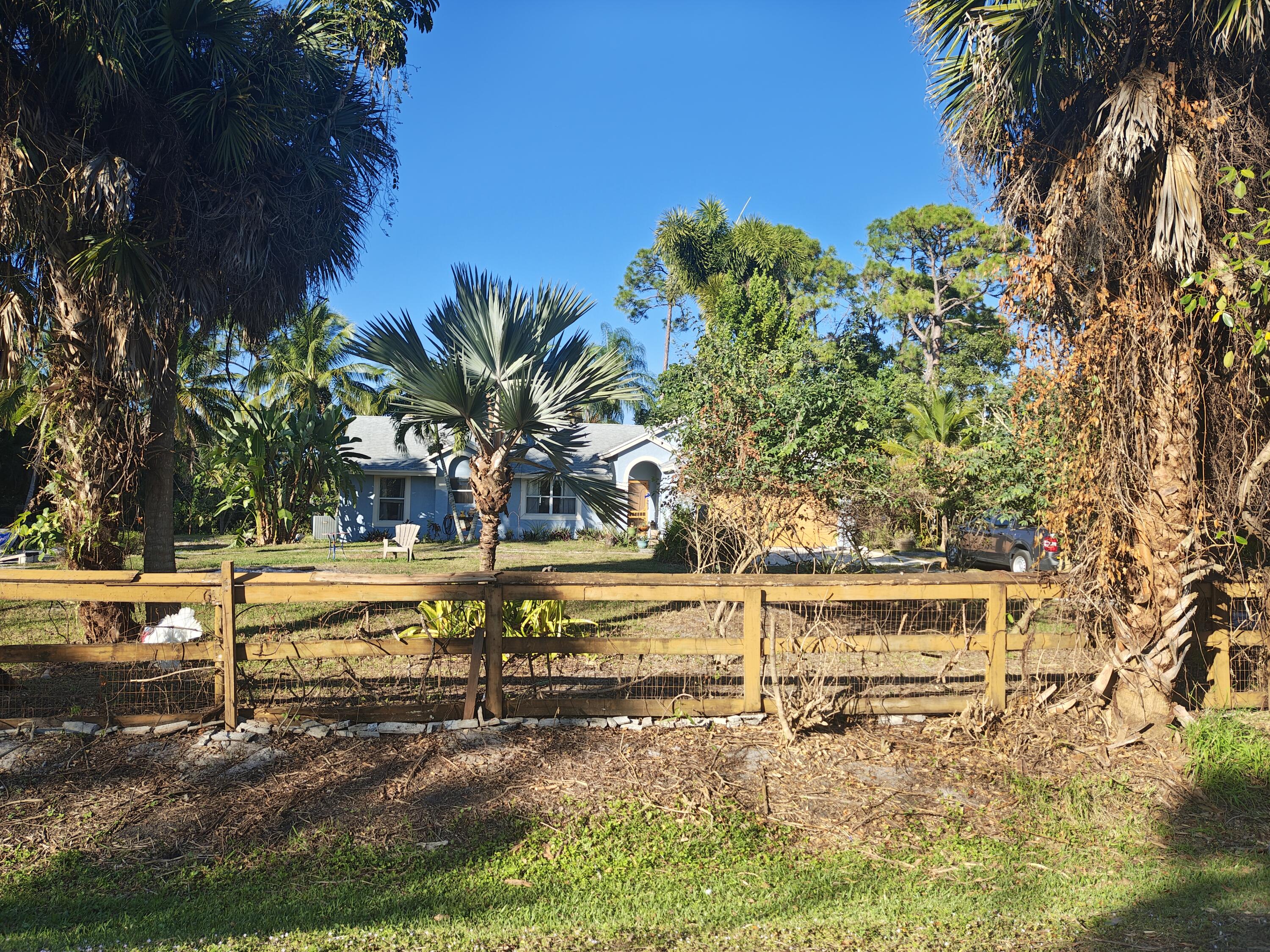 13747 42nd Road North Royal Palm Beach, FL 33411 - Photo 7 of 31 a view of a swimming pool with an ocean beach