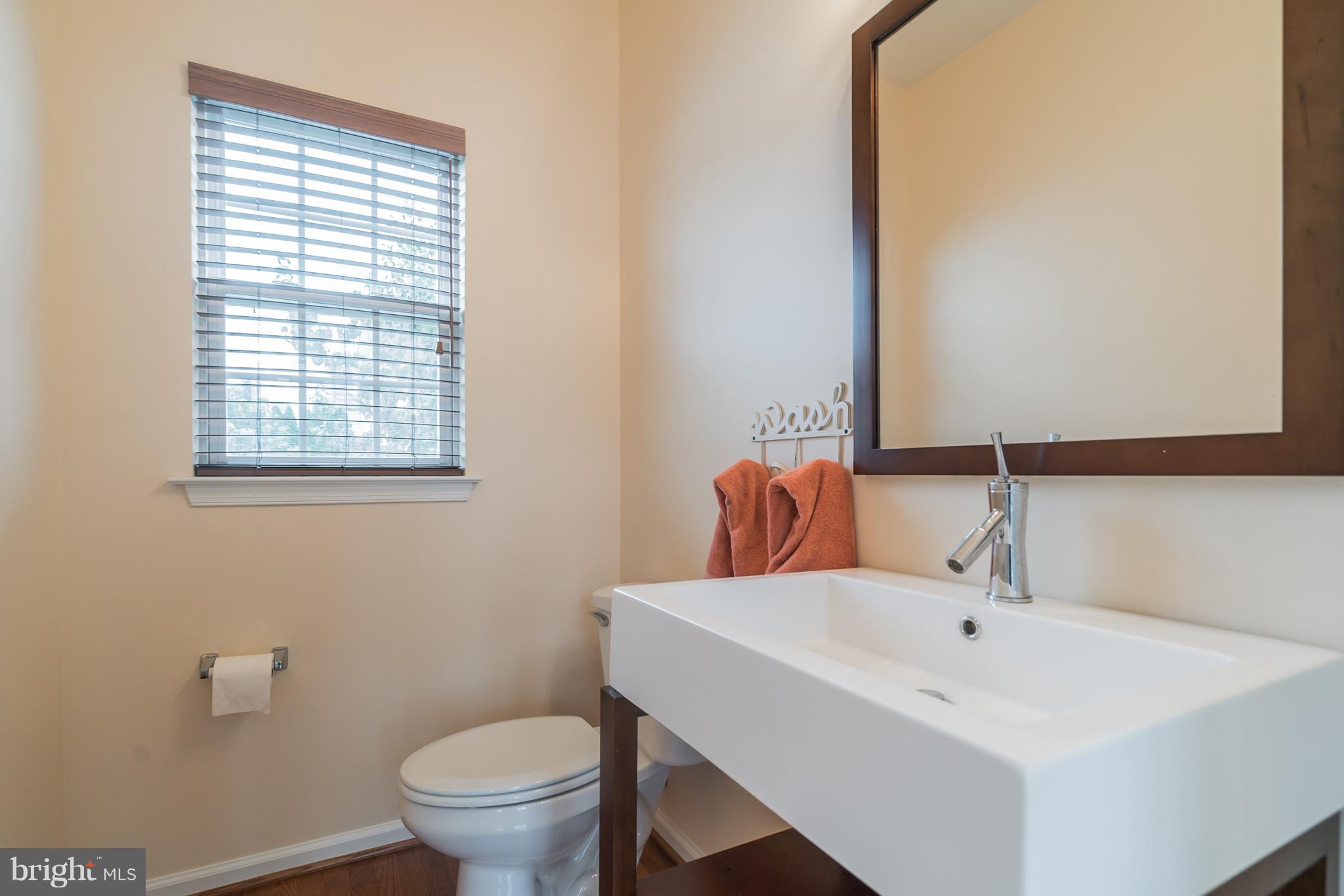 18411 Cornflower Road Boyds, MD 20841 - Photo 16 of 28 a bathroom with a sink and a toilet