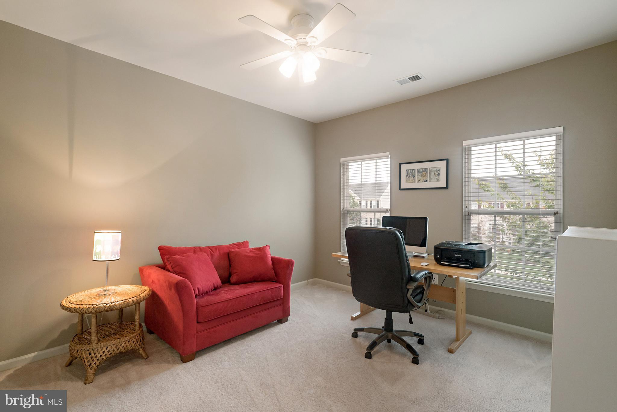 18411 Cornflower Road Boyds, MD 20841 - Photo 23 of 28 a view of a livingroom with workspace and a couch