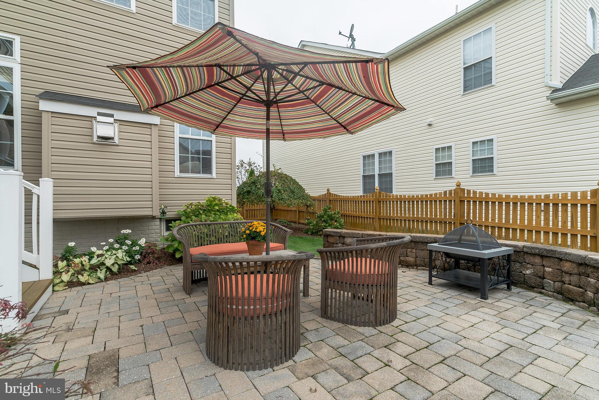 18411 Cornflower Road Boyds, MD 20841 - Photo 27 of 28 a view of a chair and table in the patio