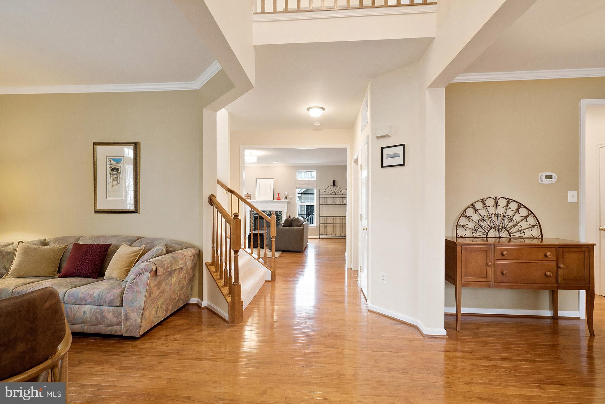18411 Cornflower Road Boyds, MD 20841 - Photo 4 of 28 a living room with furniture and wooden floor