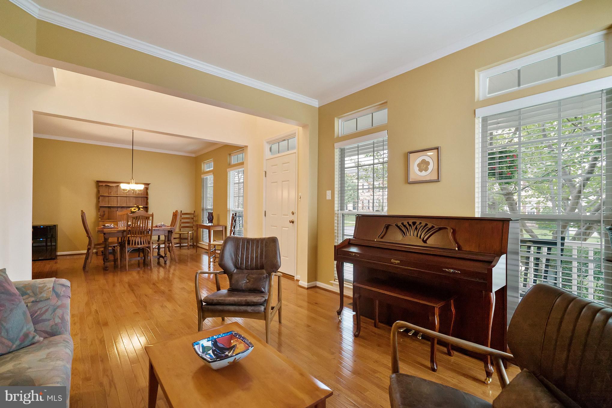 18411 Cornflower Road Boyds, MD 20841 - Photo 6 of 28 a living room with furniture and wooden floor