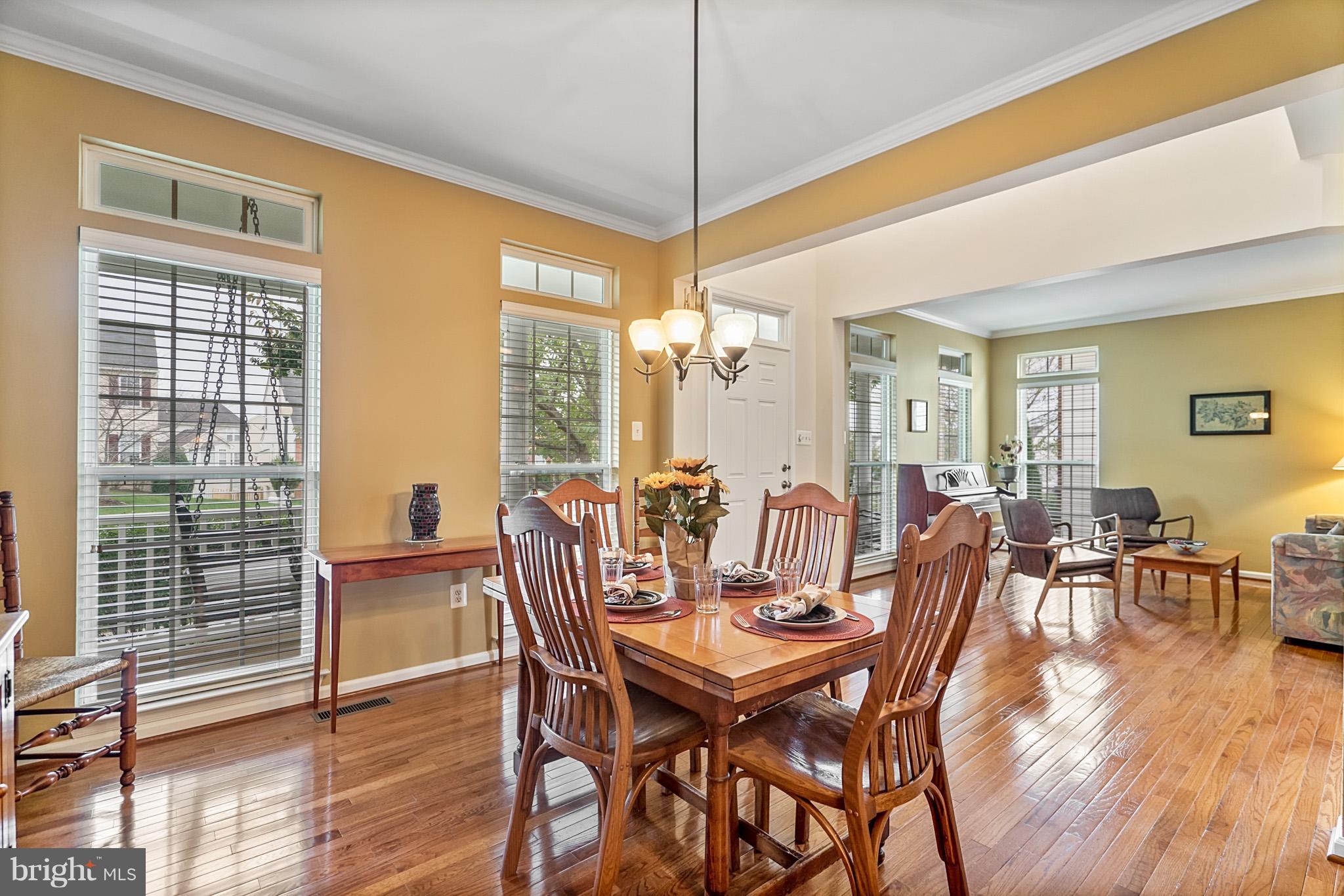 18411 Cornflower Road Boyds, MD 20841 - Photo 8 of 28 a view of a dining room with furniture window and wooden floor