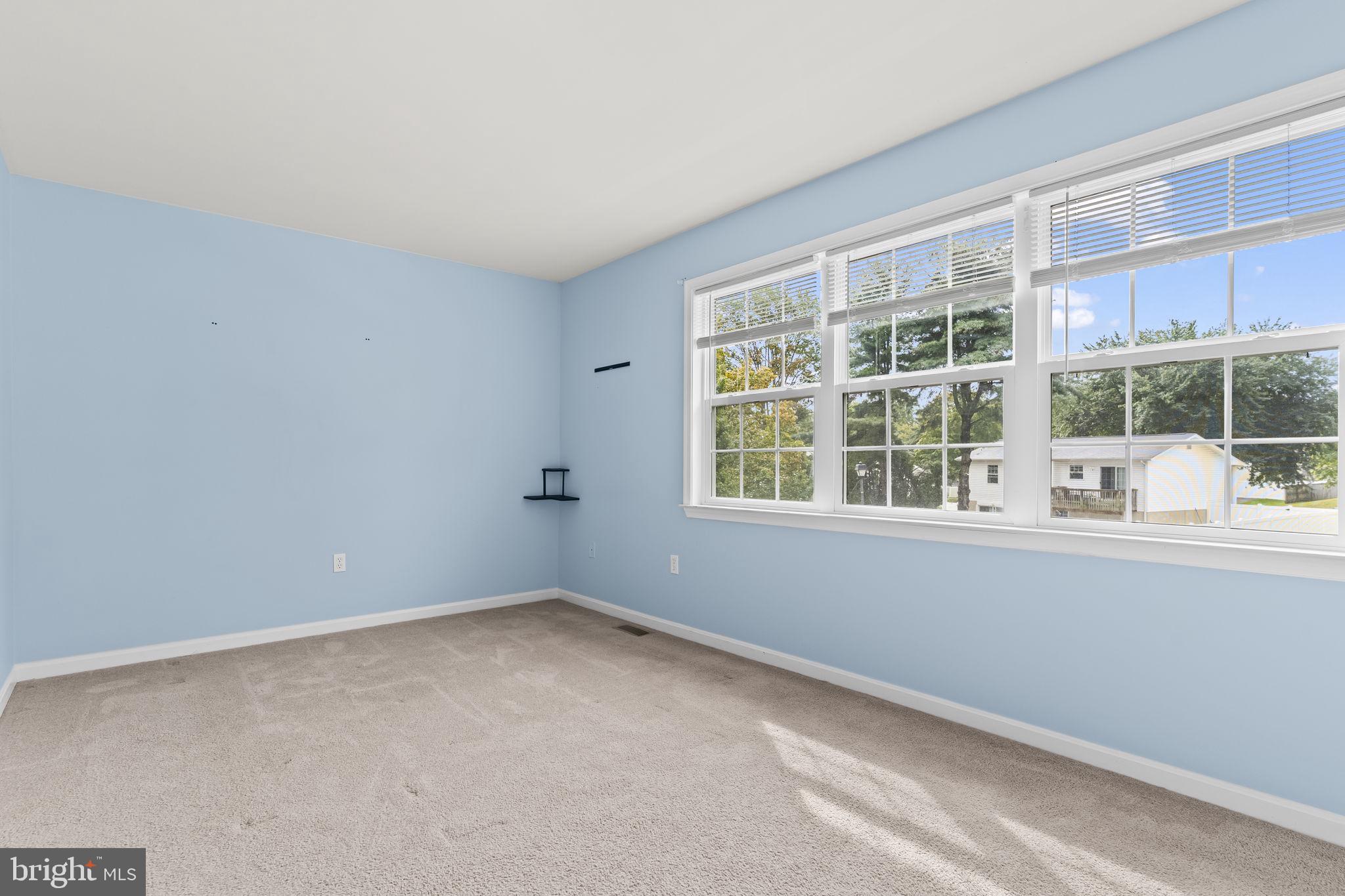 8536 F Street Chesapeake Beach, MD 20732 - Photo 17 of 26 an empty room with windows