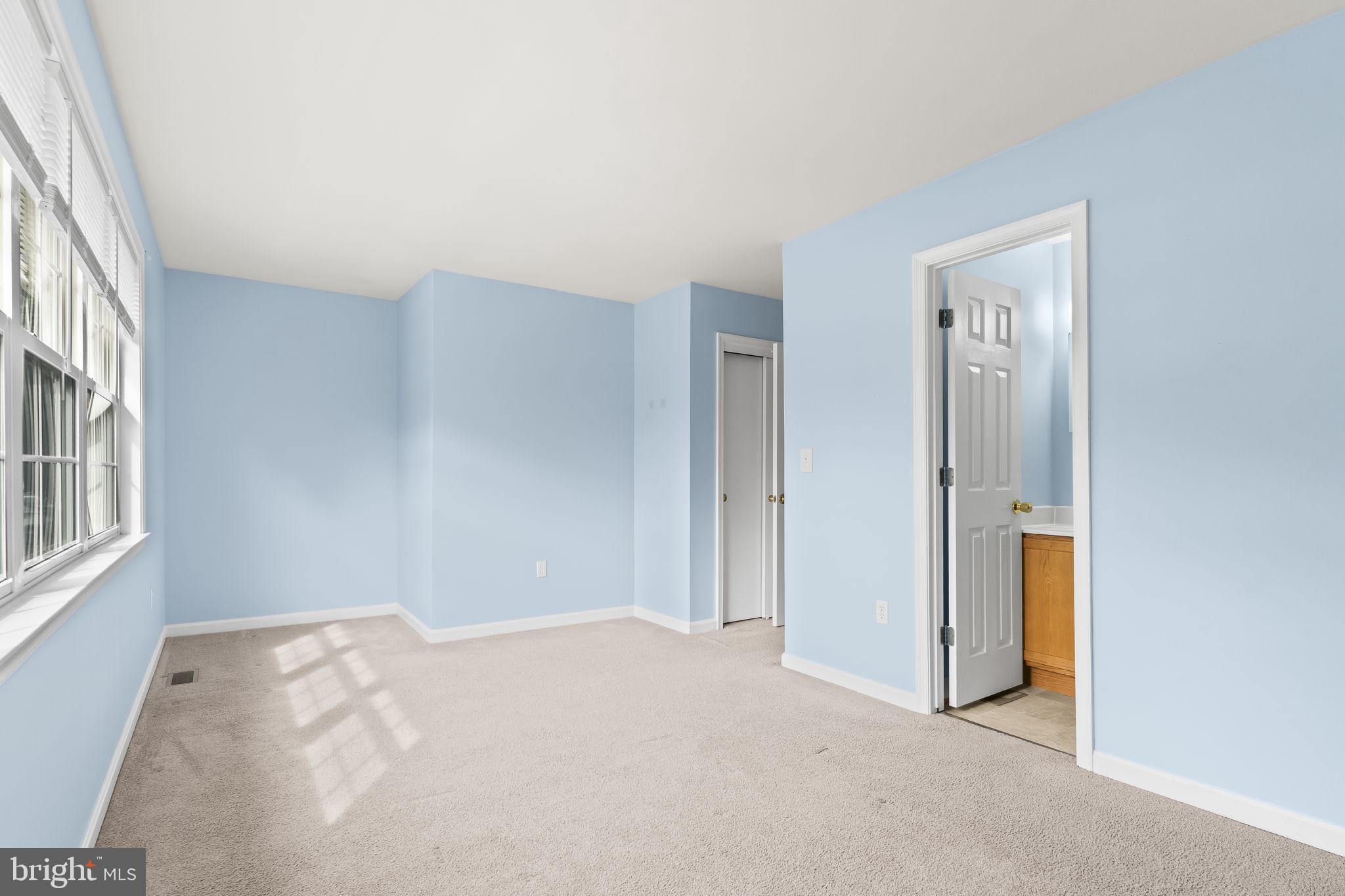 8536 F Street Chesapeake Beach, MD 20732 - Photo 18 of 26 a view of an empty room with a window