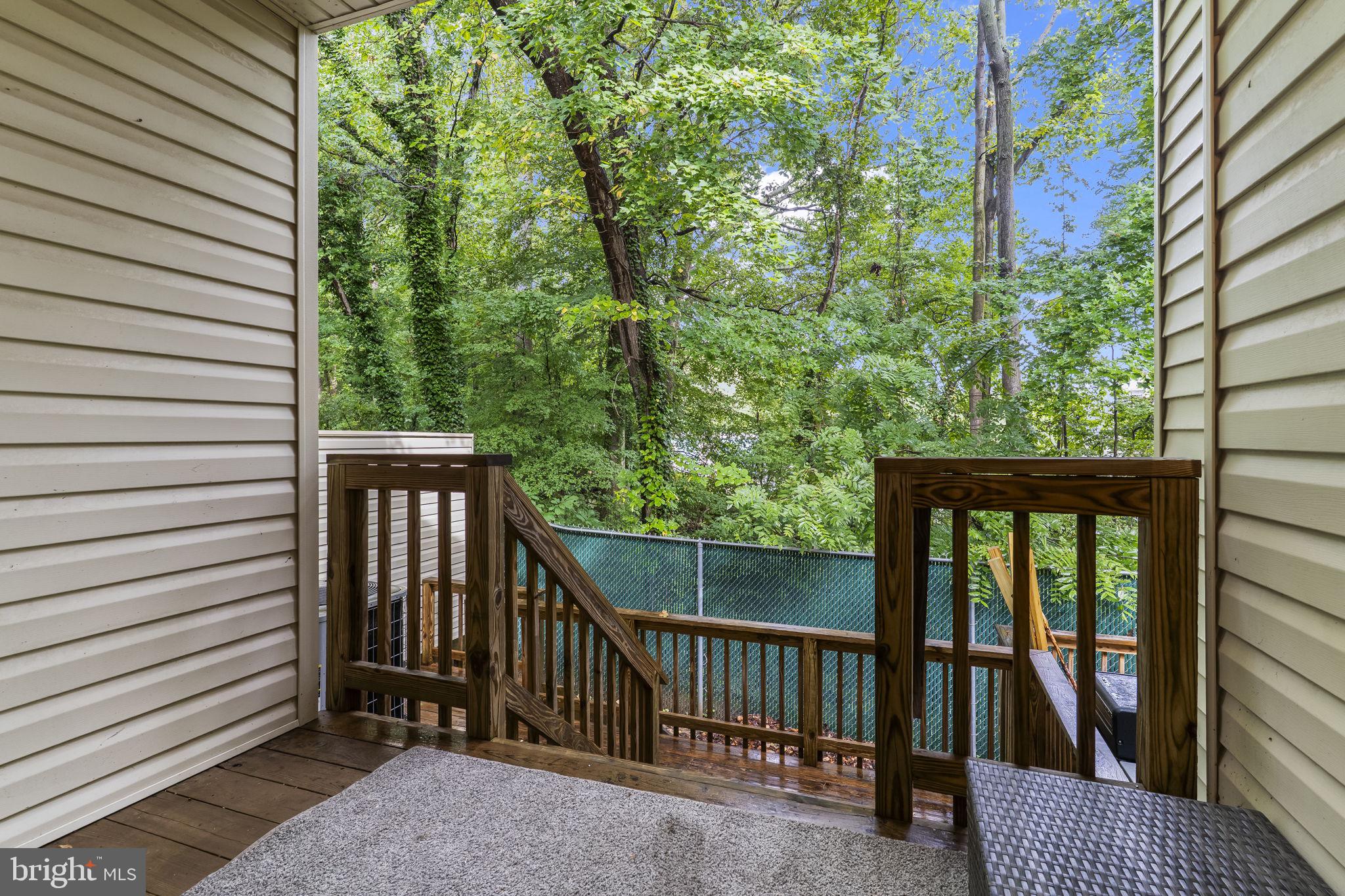 8536 F Street Chesapeake Beach, MD 20732 - Photo 21 of 26 a view of a balcony with wooden floor