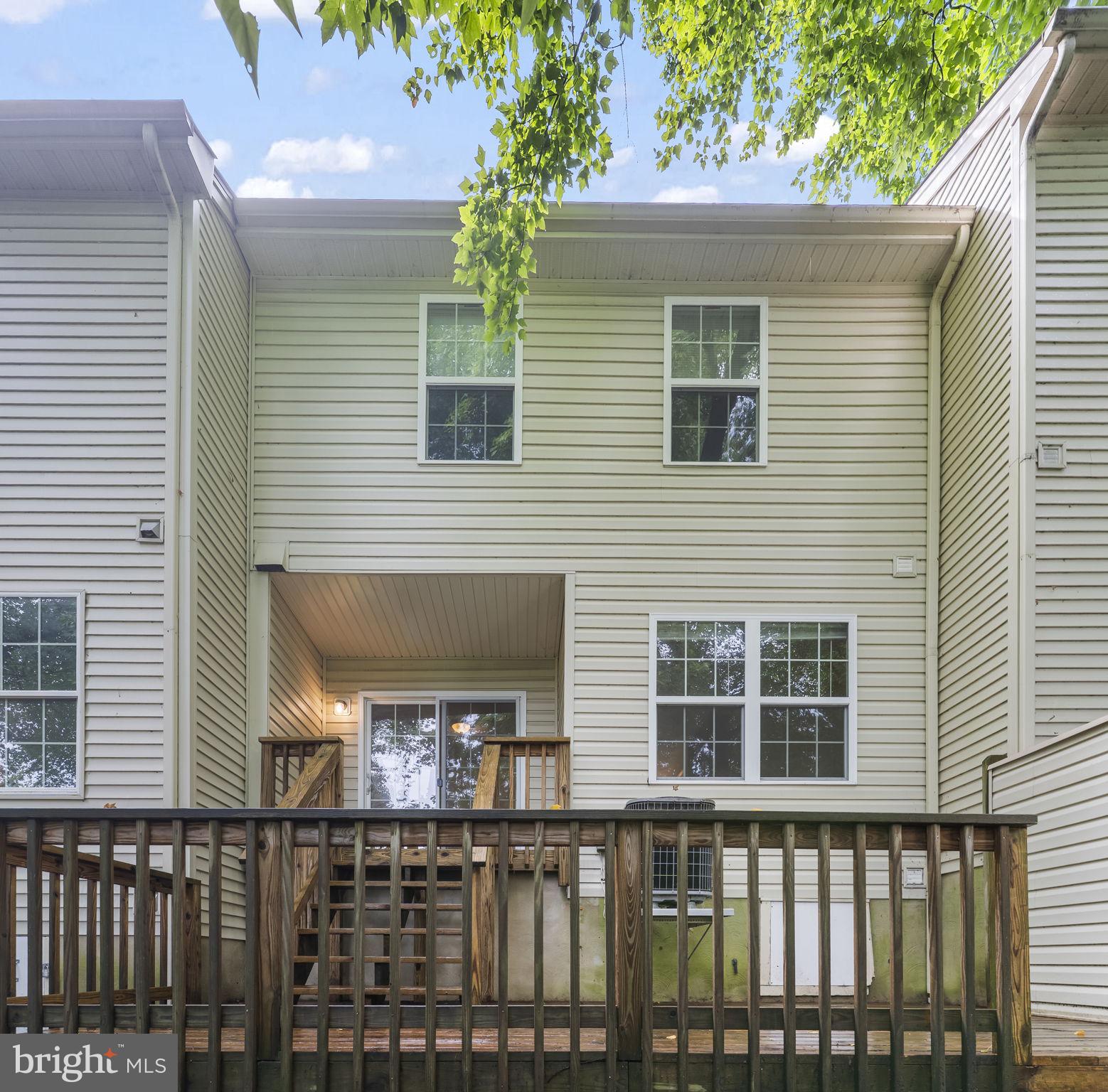 8536 F Street Chesapeake Beach, MD 20732 - Photo 23 of 26 a front view of a house with a balcony