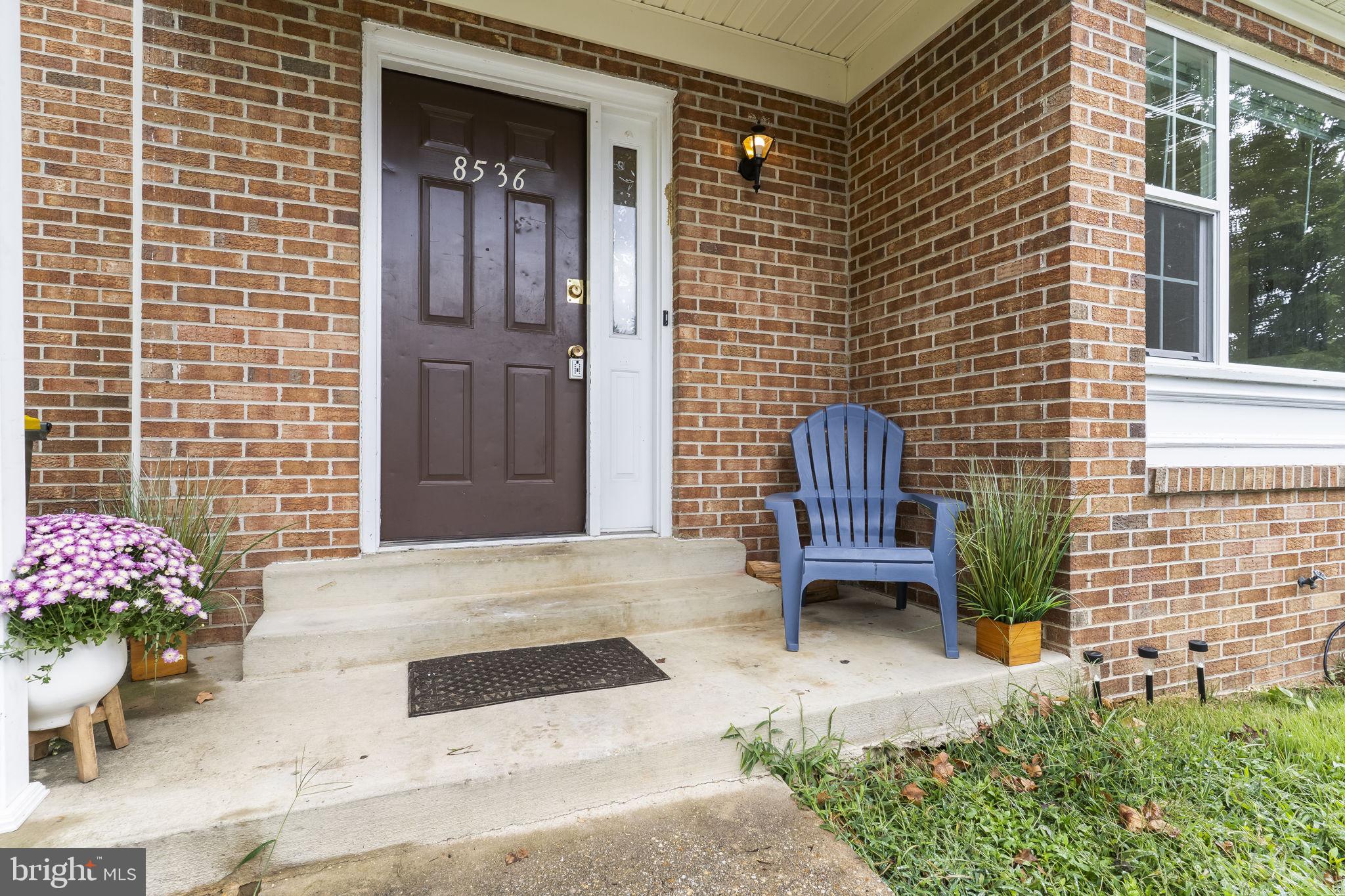 8536 F Street Chesapeake Beach, MD 20732 - Photo 3 of 26 a bench in front of house