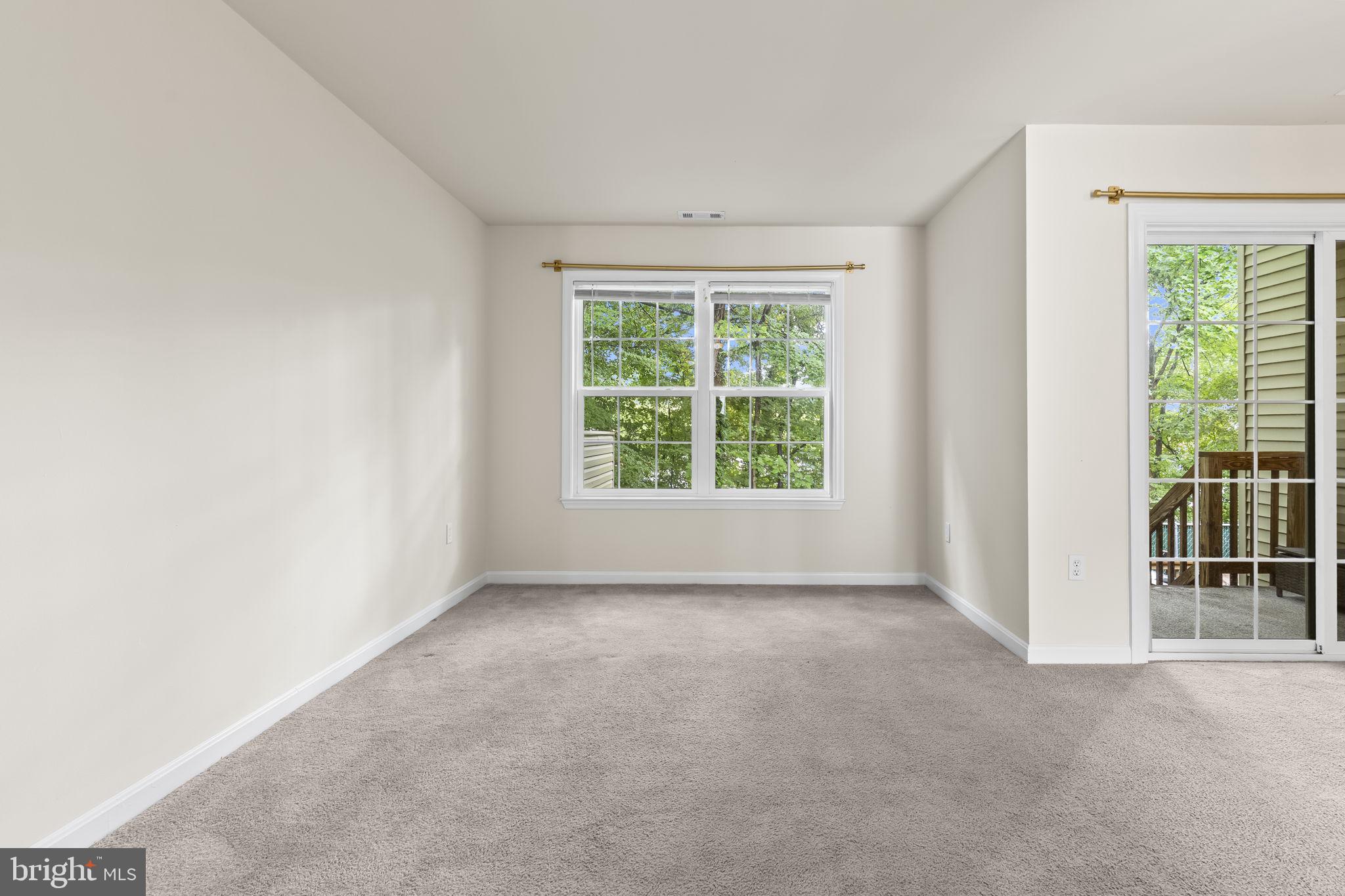 8536 F Street Chesapeake Beach, MD 20732 - Photo 4 of 26 an empty room with windows