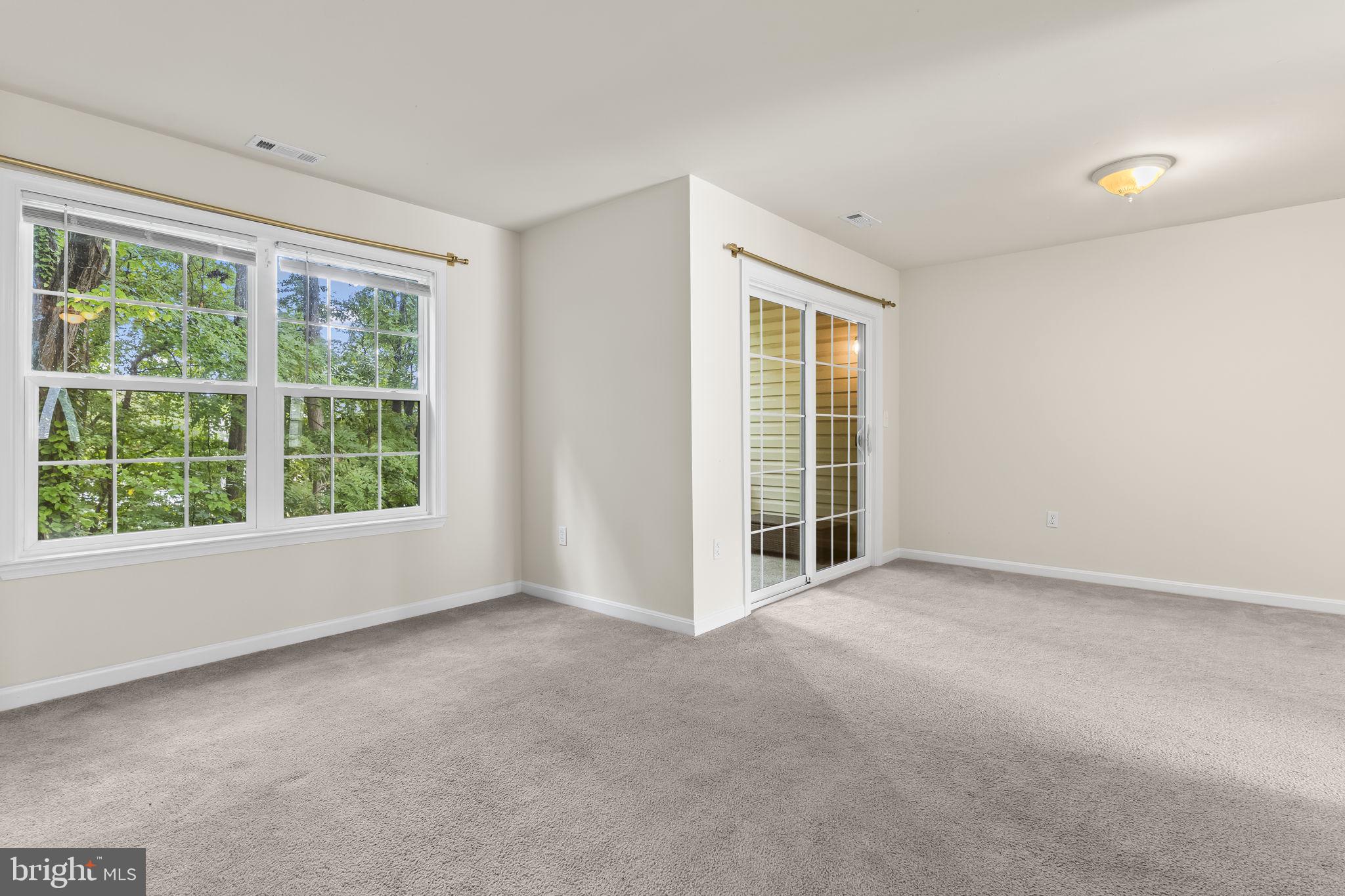 8536 F Street Chesapeake Beach, MD 20732 - Photo 5 of 26 an empty room with windows