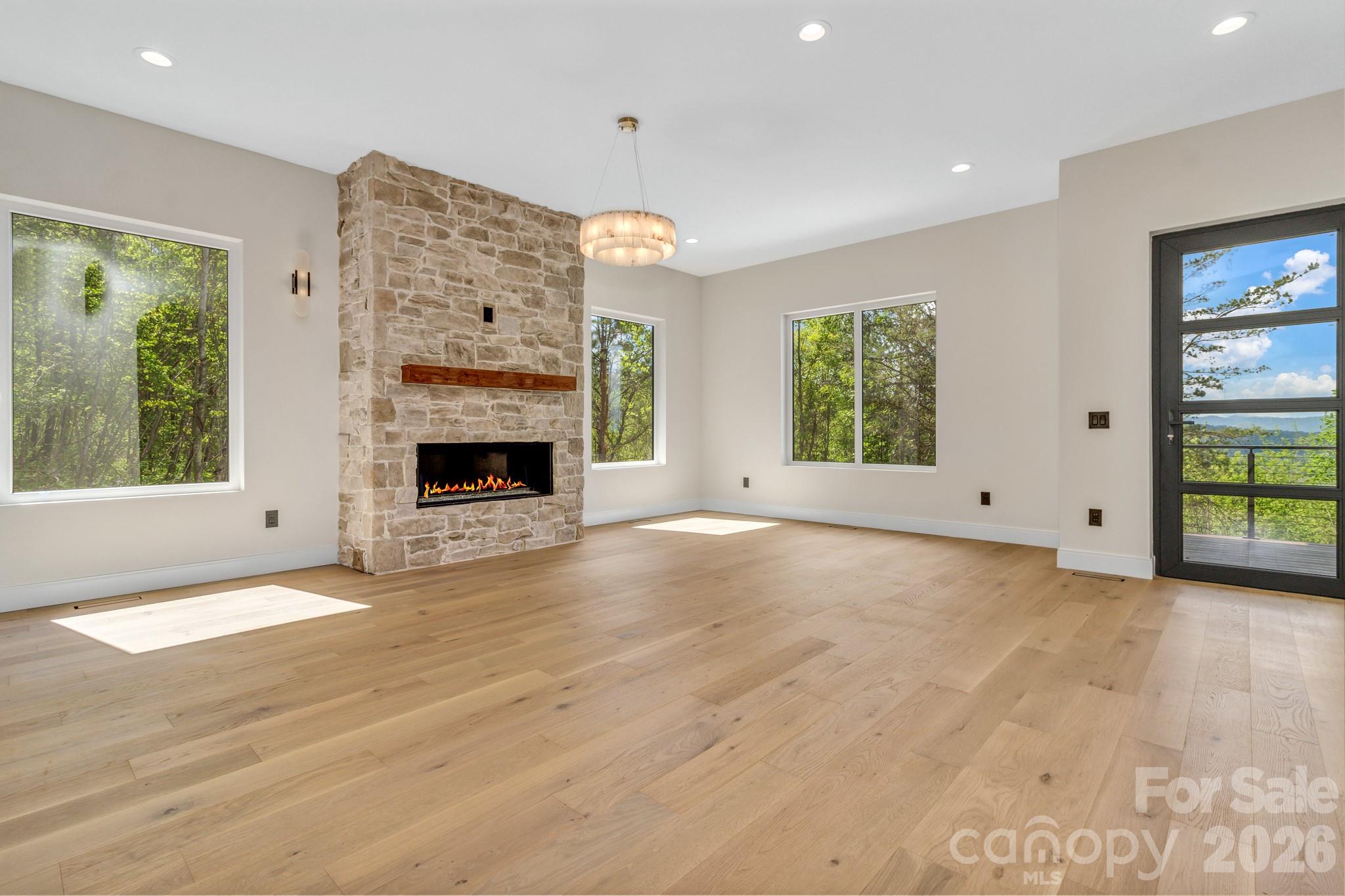 134 View Ridge Parkway Leicester, NC 28748 - Photo 8 of 48 a view of an empty room with window and fire place