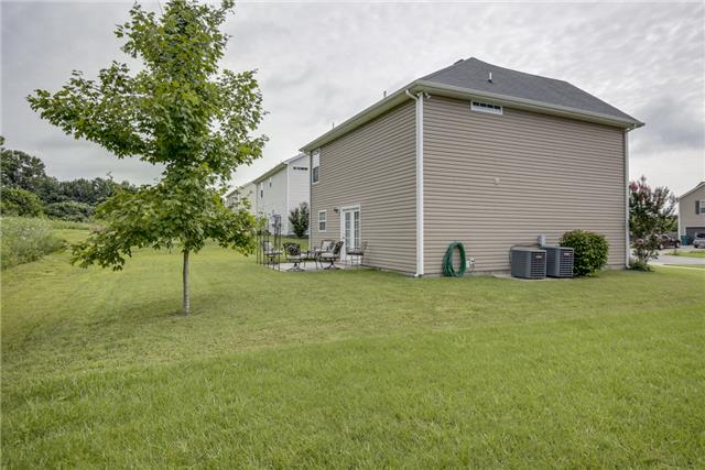 1042 Woodall Road Lebanon, TN 37090 - Photo 16 of 16 a backyard of a house with table and chairs