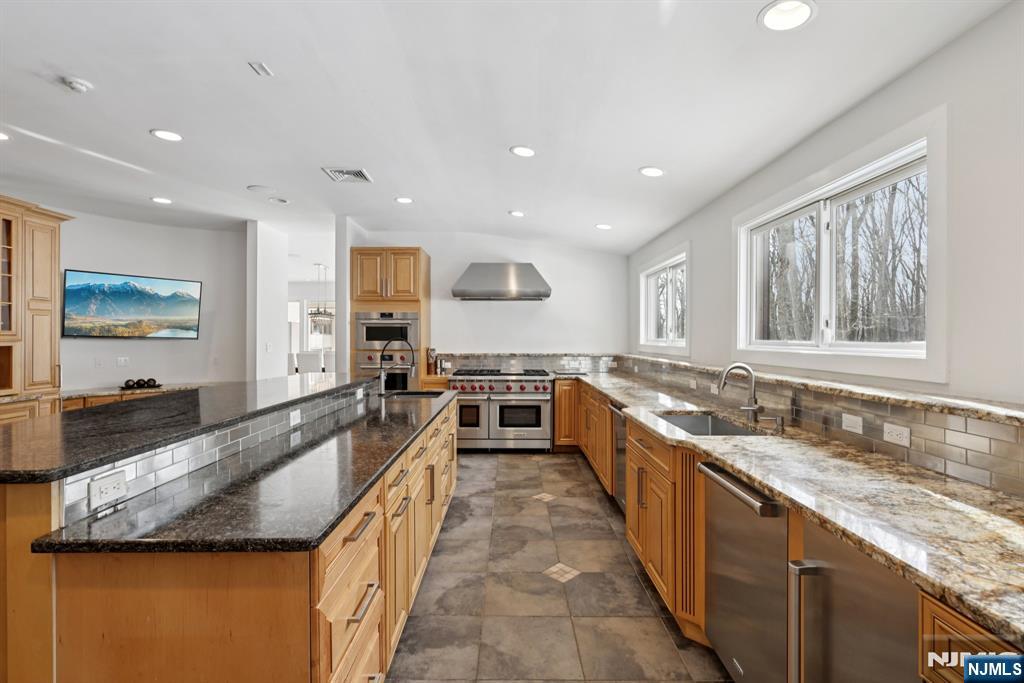 20 Mt Pleasant Road Morristown, NJ 07960 - Photo 14 of 41 a large kitchen with granite countertop a large counter top and stainless steel appliances