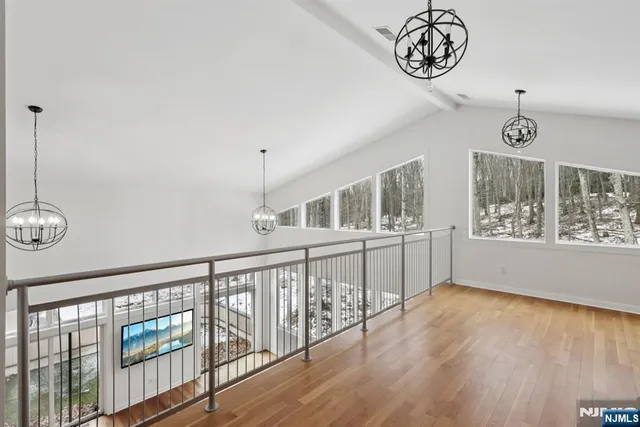 a view of an entryway with wooden floor