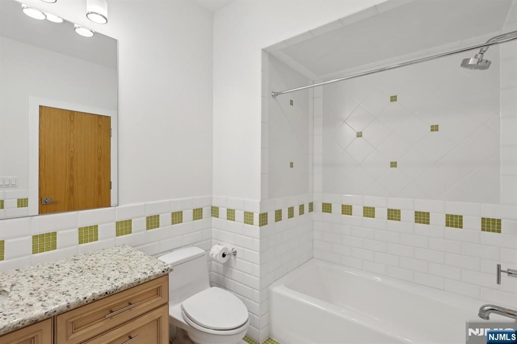 20 Mt Pleasant Road Morristown, NJ 07960 - Photo 25 of 41 a bathroom with a granite countertop bathtub sink vanity mirror and toilet