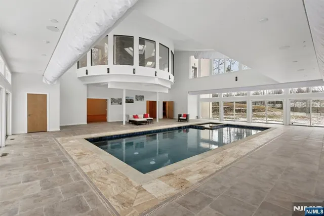 a view of a large building with swimming pool