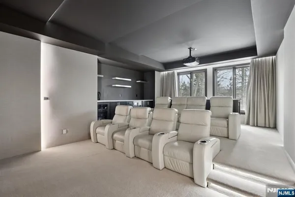 a living room with furniture a ceiling fan and a rug