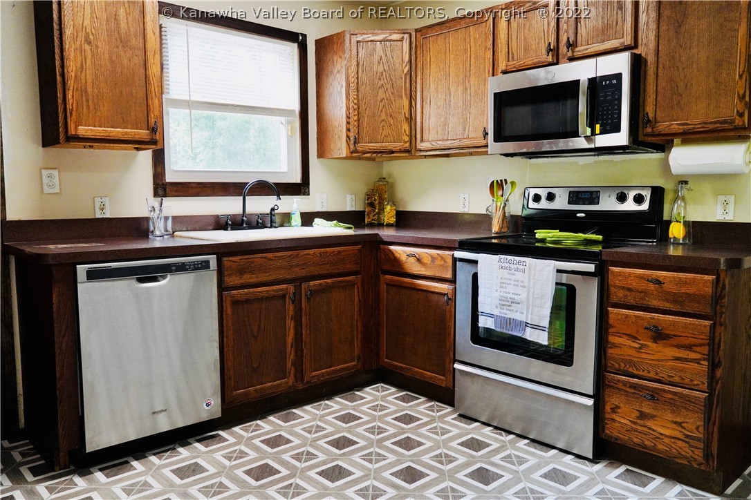 198 Ritz Mountain Road Elkview, WV 25071 - Photo 2 of 23 In kitchen you will have a dishwasher, cook range, (brand new) microwave and fridge.