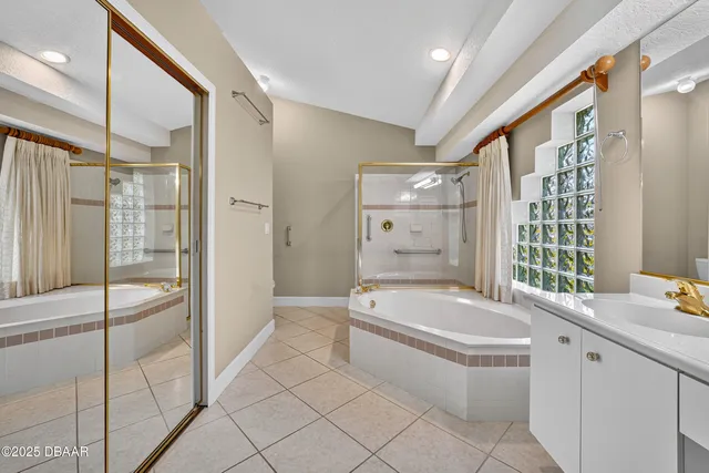a bathroom with a granite countertop sink a toilet and shower