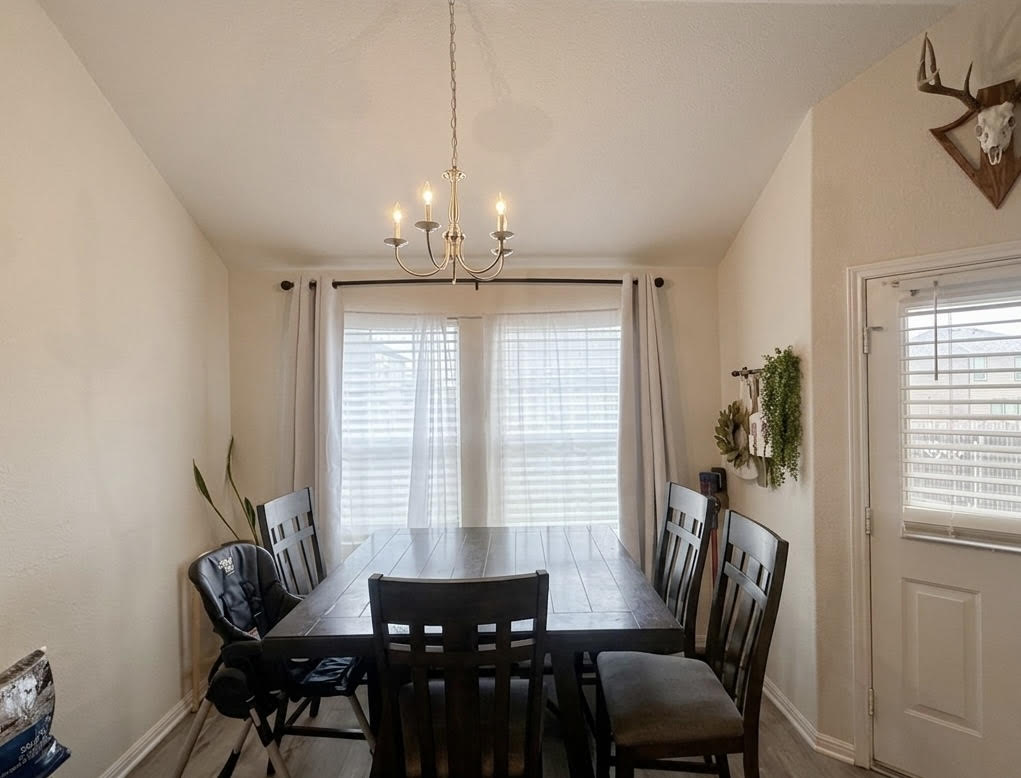 107 Jim Dandy Drive Elgin, TX 78621 - Photo 6 of 15 An inviting dining area offers a functional space for everyday meals.