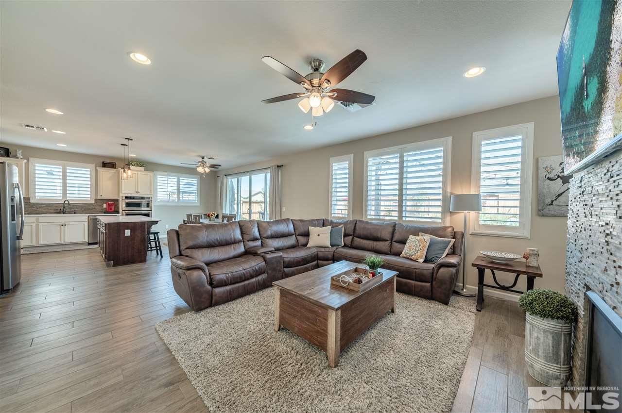 2935 Bonfire Lane Reno, NV 89521 - Photo 11 of 39 a living room with furniture kitchen view and a large window