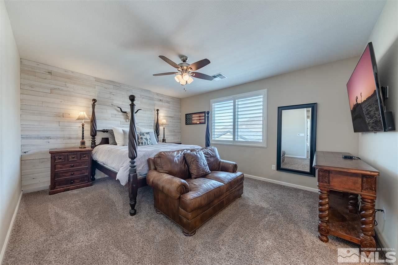 2935 Bonfire Lane Reno, NV 89521 - Photo 16 of 39 a living room with furniture and a flat screen tv