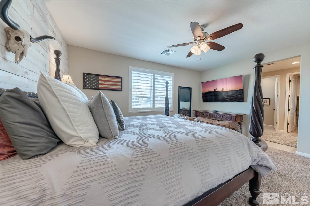 2935 Bonfire Lane Reno, NV 89521 - Photo 17 of 39 a bed room with a bed and a television
