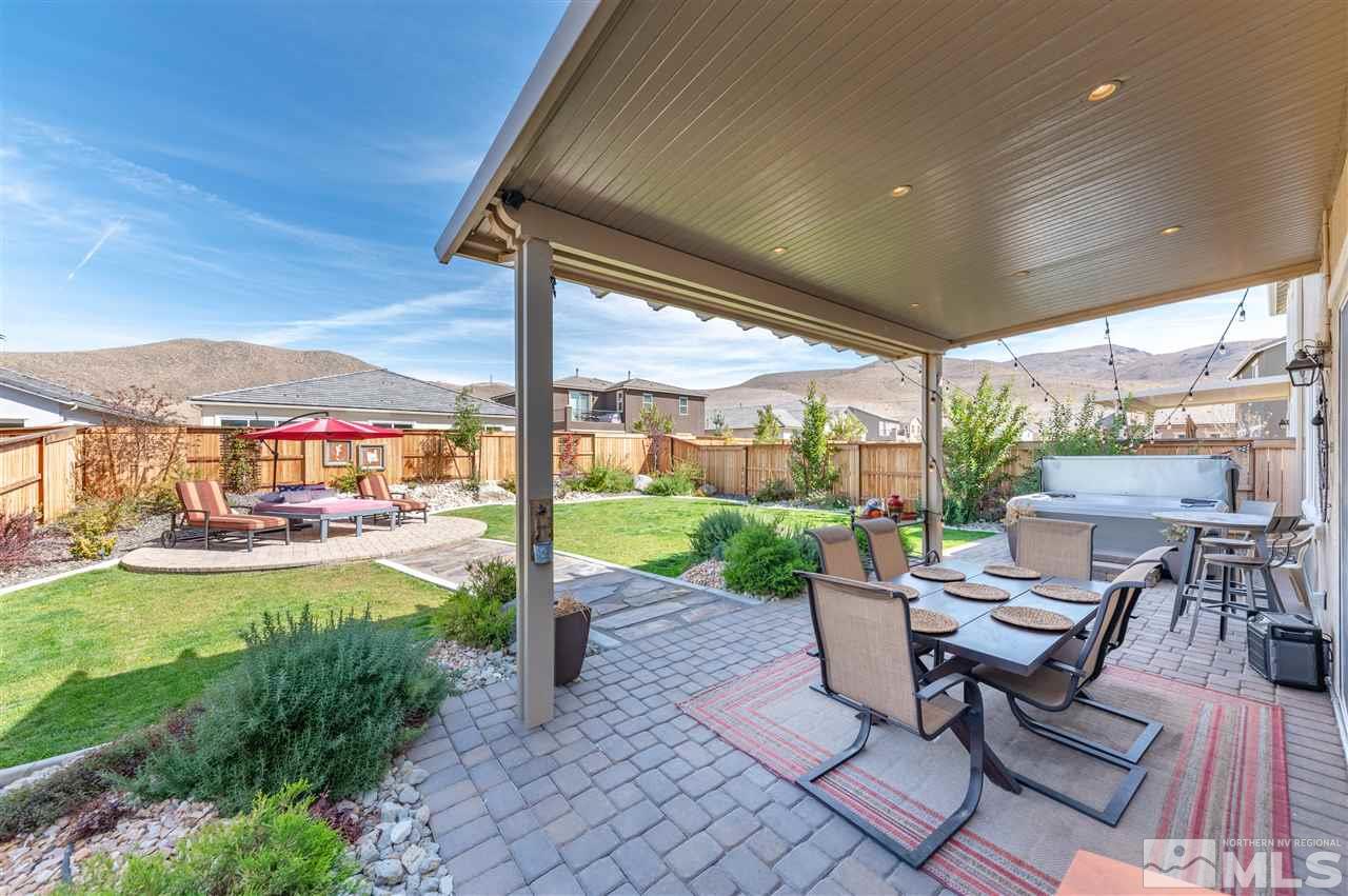 2935 Bonfire Lane Reno, NV 89521 - Photo 26 of 39 a view of a patio with a table chairs and a backyard