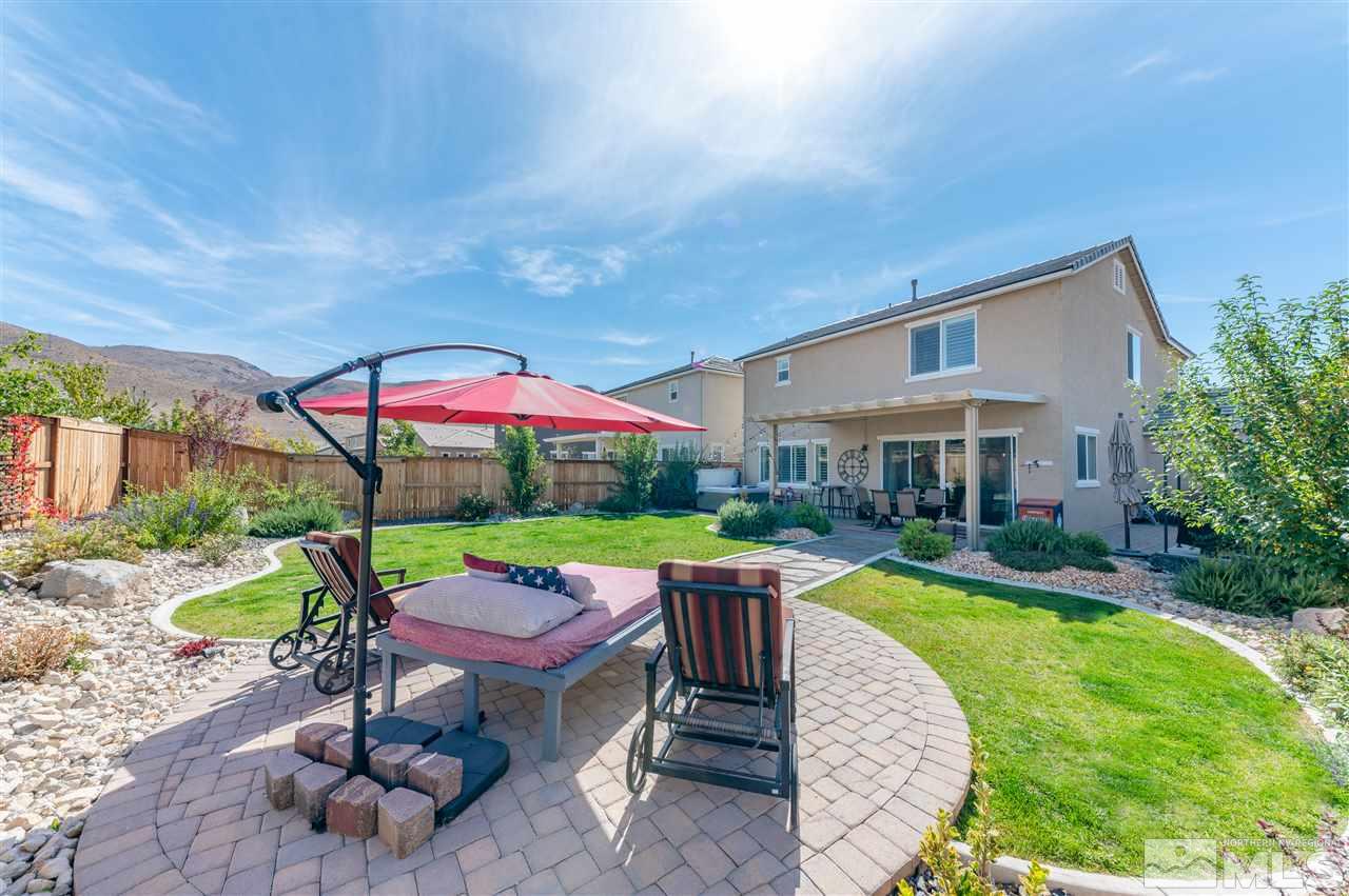 2935 Bonfire Lane Reno, NV 89521 - Photo 28 of 39 a view of a swimming pool with a garden and plants
