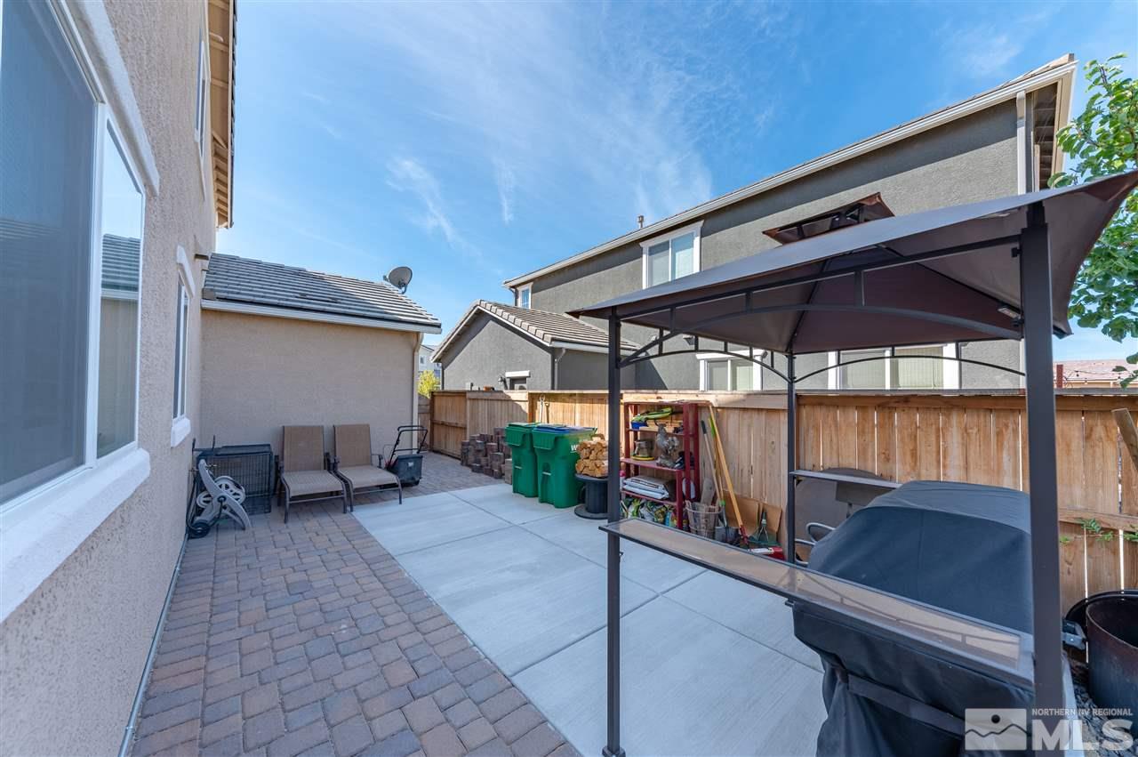 2935 Bonfire Lane Reno, NV 89521 - Photo 38 of 39 a patio with a patio table and chairs