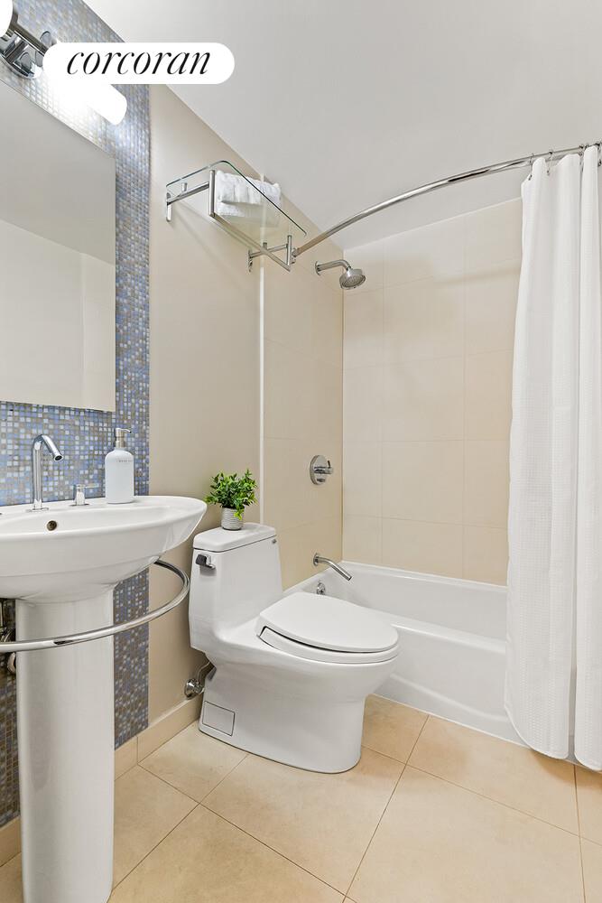 124 West 87th Street Manhattan, NY 10024 - Photo 15 of 37 a bathroom with a sink toilet and shower