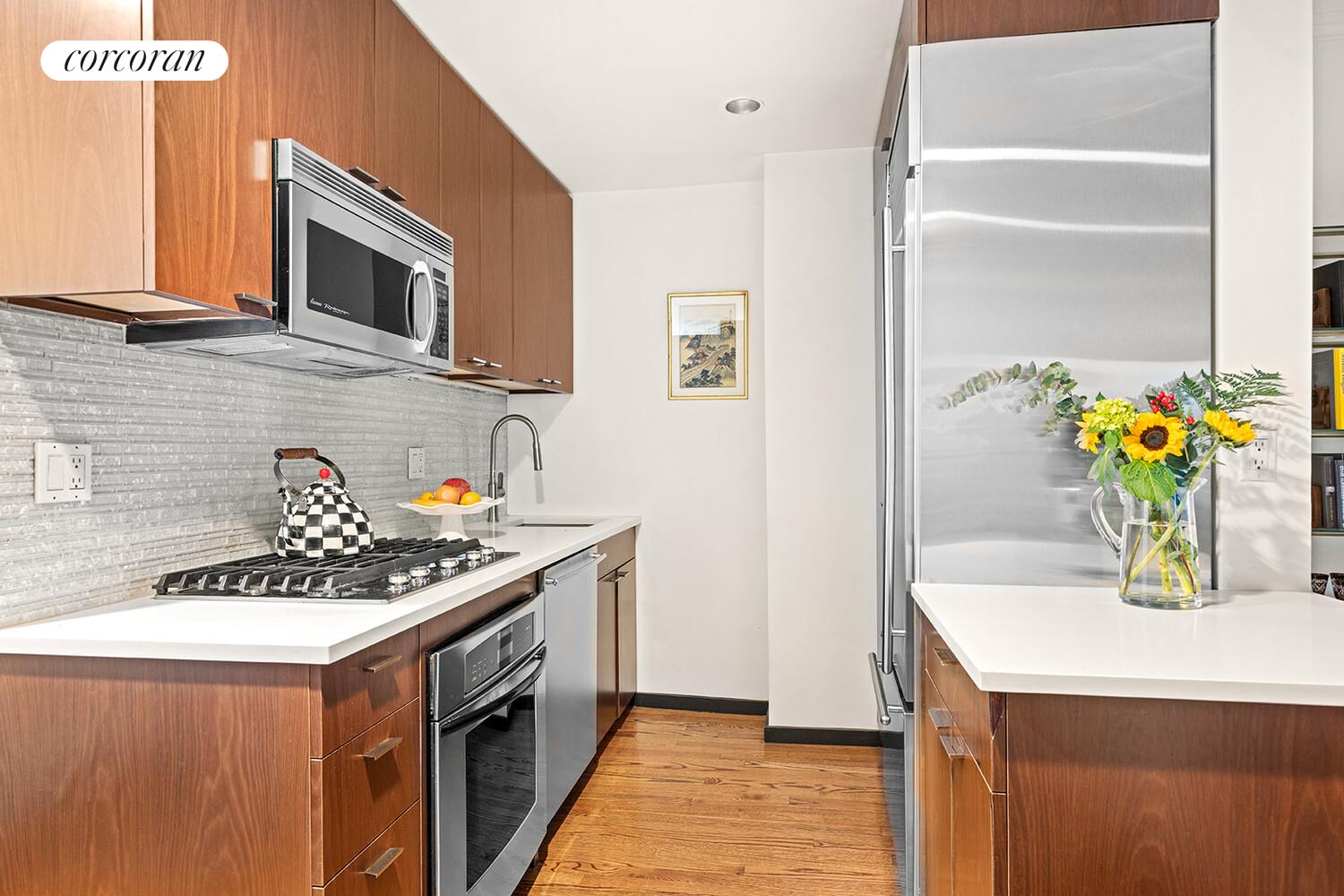 124 West 87th Street Manhattan, NY 10024 - Photo 20 of 37 a kitchen that has a sink and a stove