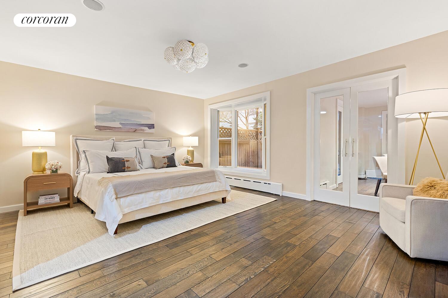 124 West 87th Street Manhattan, NY 10024 - Photo 8 of 37 a bedroom with a large bed and a couch