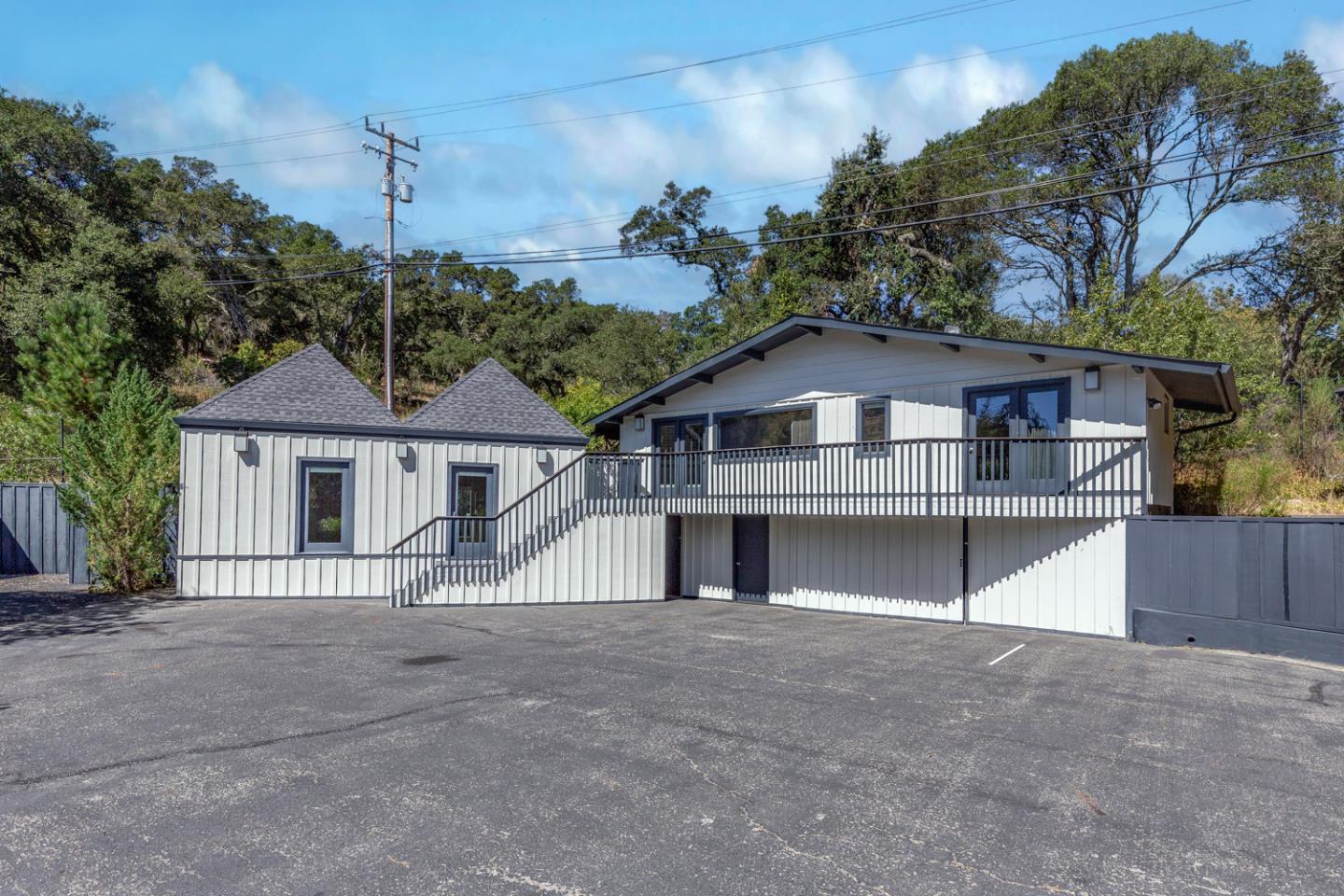 835 La Honda Road Woodside, CA 94062 - Photo 19 of 26 a front view of a house with a yard and garage