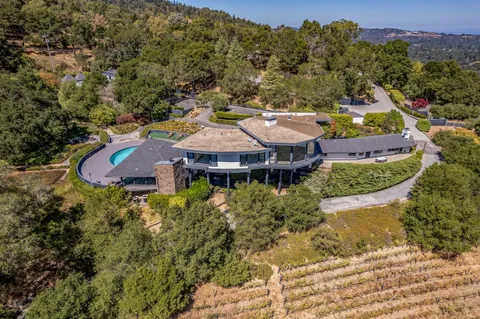 an aerial view of a house with a garden