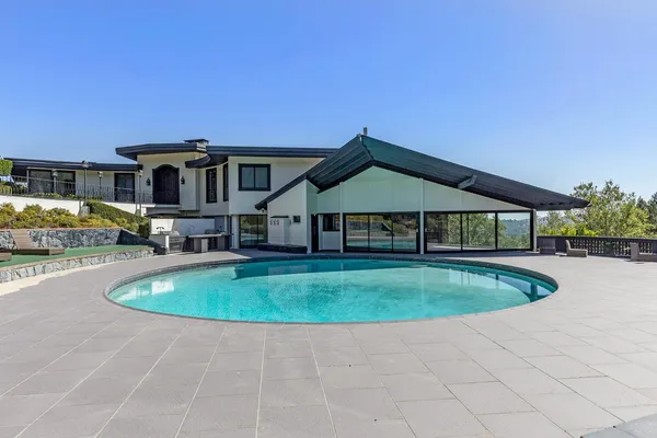 a front view of a house with swimming pool