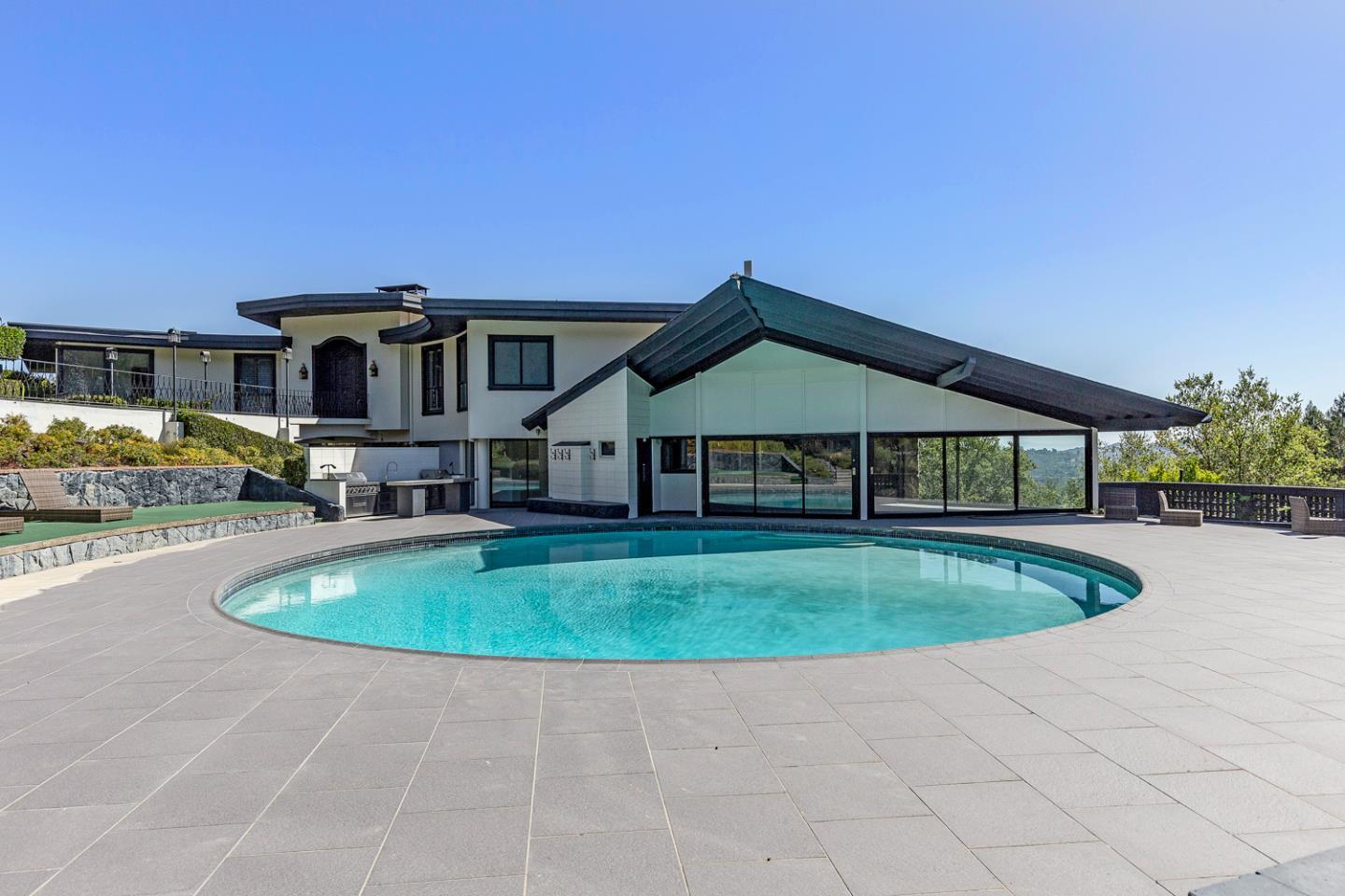 835 La Honda Road Woodside, CA 94062 - Photo 23 of 26 a front view of a house with swimming pool