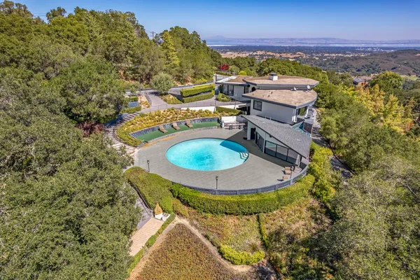 an aerial view of a house with outdoor space