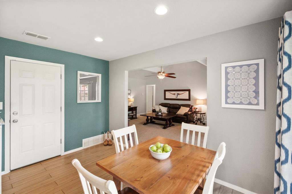 1520 Timbercreek Road Benbrook, TX 76126 - Photo 12 of 30 a view of a dining room with furniture and wooden floor