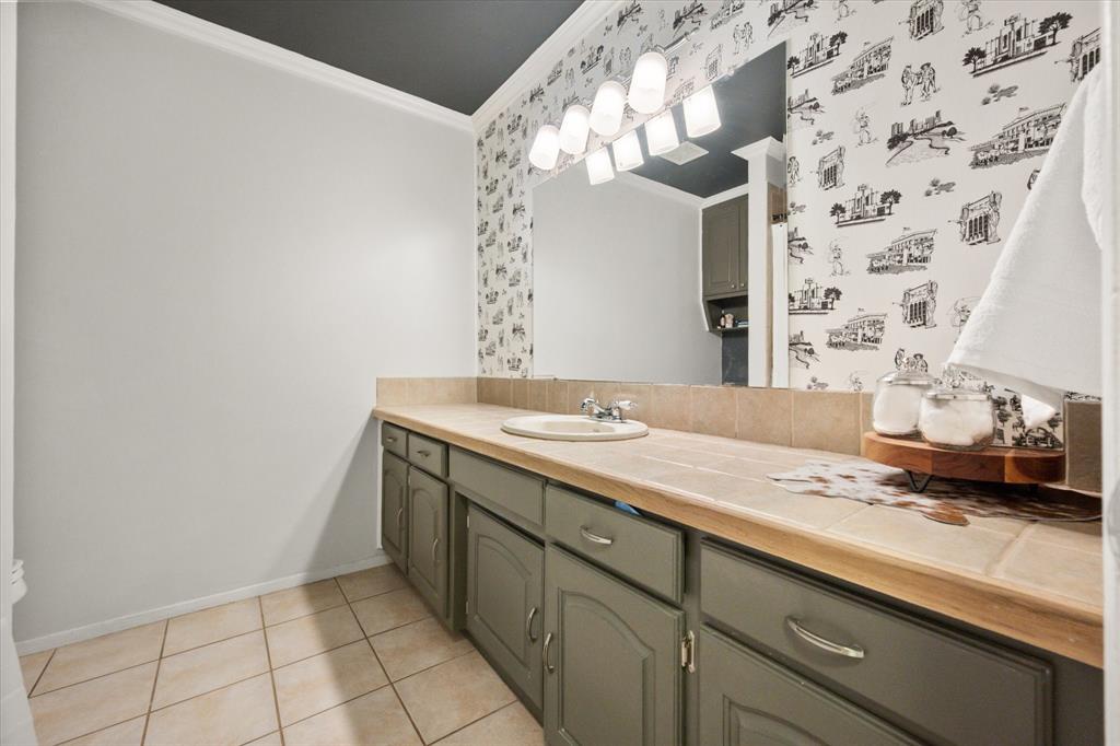 1520 Timbercreek Road Benbrook, TX 76126 - Photo 25 of 30 a bathroom with a granite countertop sink and a mirror