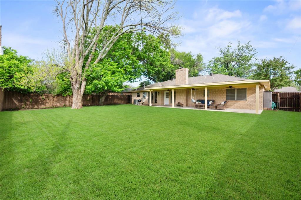 1520 Timbercreek Road Benbrook, TX 76126 - Photo 5 of 30 a view of a house with a backyard