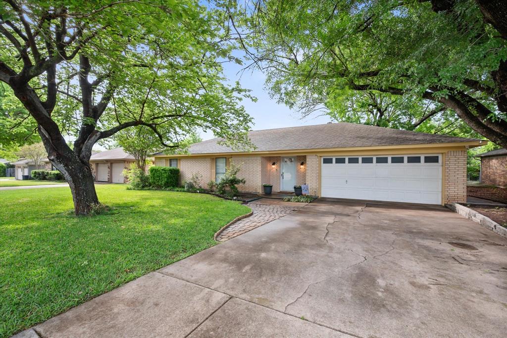 1520 Timbercreek Road Benbrook, TX 76126 - Photo 6 of 30 a view of a house with a yard and large tree
