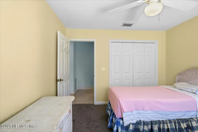 a view of a workspace with furniture window and a chandelier