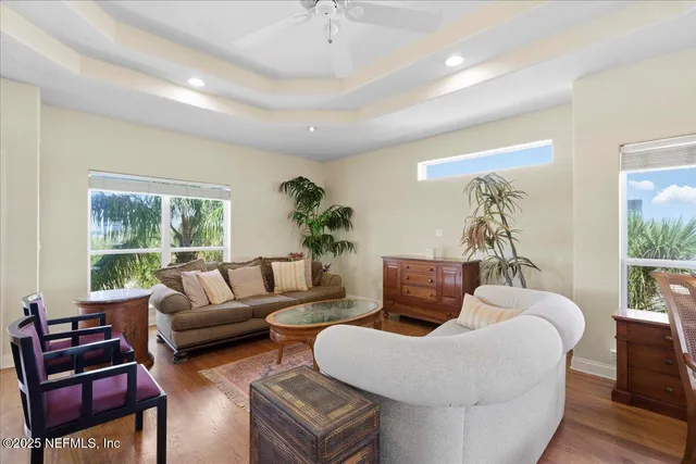 a en suite bathroom with a double vanity sink a mirror and a toilet