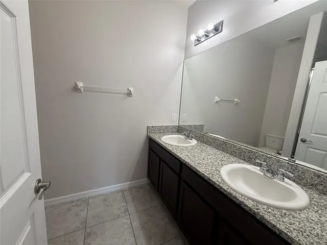 a bathroom with a shower and toilet
