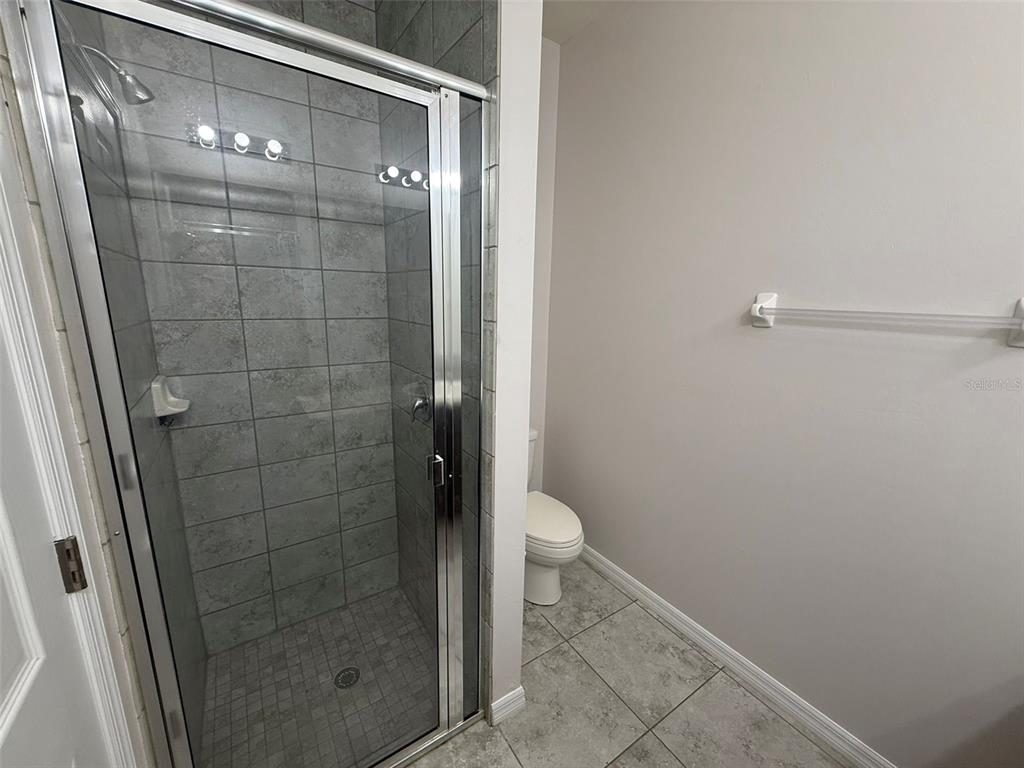 24484 Zephyr Court Punta Gorda, FL 33983 - Photo 15 of 22 a bathroom with a shower and toilet