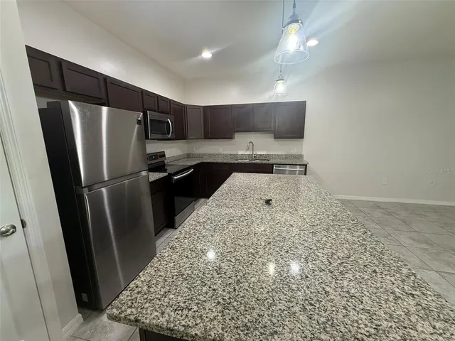 a kitchen with a stove and a microwave