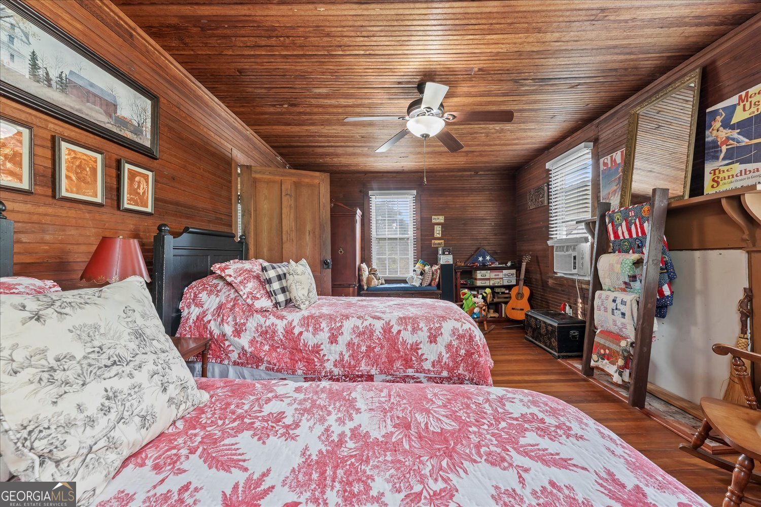 6644 East Cadley Road Norwood, GA 30821 - Photo 40 of 53 a bed room with a bed and a walk in closet